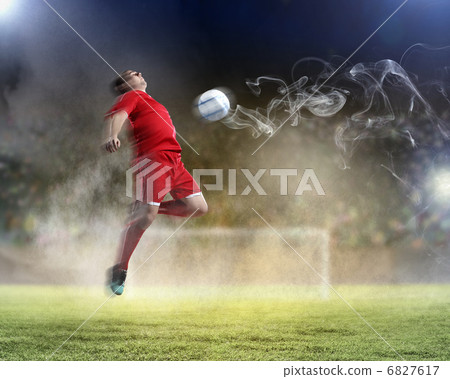 football player striking the ball football player striking the ball 6827617
