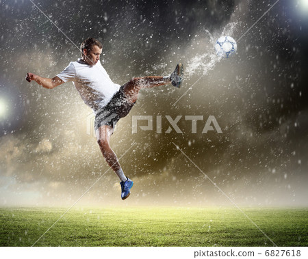 football player striking the ball football player striking the ball 6827618