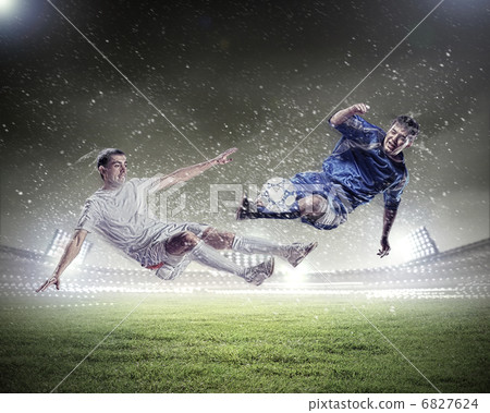 two football players striking the ball two football players striking the ball 6827624