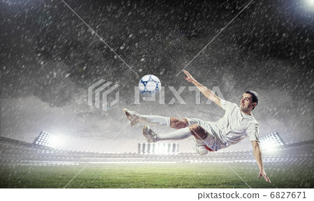 football player striking the ball football player striking the ball 6827671