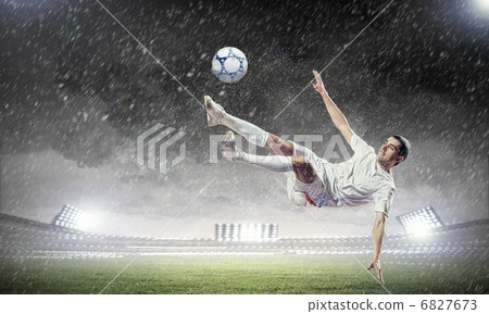 football player striking the ball football player striking the ball 6827673