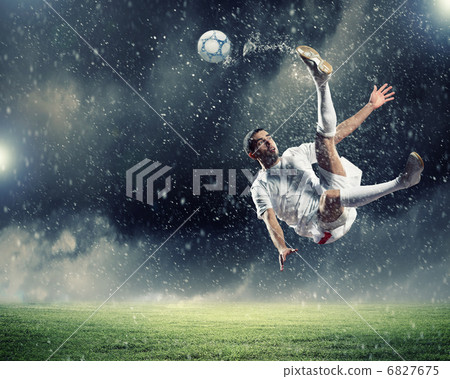 football player striking the ball 6827675