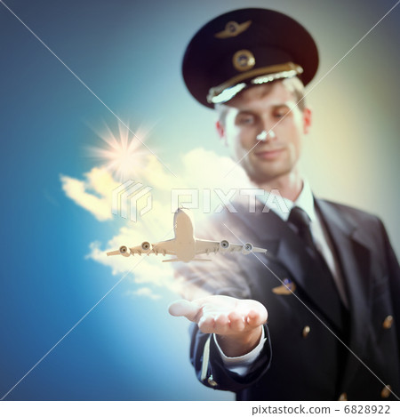 Image of pilot with plane in hand Image of pilot with plane in hand 6828922