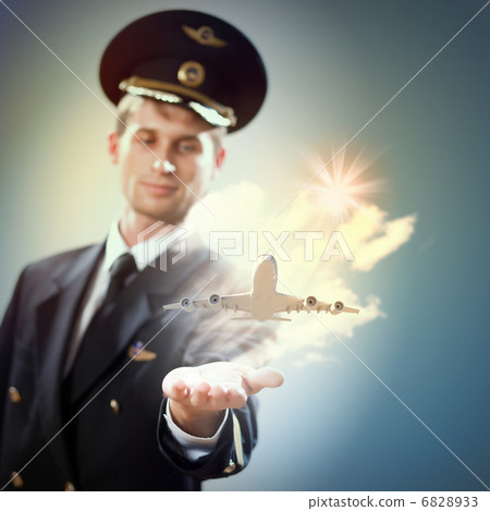 Image of pilot with plane in hand Image of pilot with plane in hand 6828933