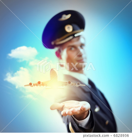 Image of pilot with plane in hand Image of pilot with plane in hand 6828936