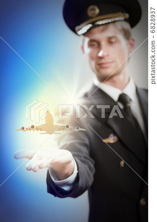 Image of pilot with plane in hand Image of pilot with plane in hand 6828937