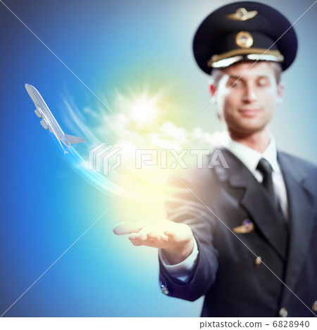 Image of pilot with plane in hand Image of pilot with plane in hand 6828940