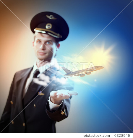 Image of pilot with plane in hand Image of pilot with plane in hand 6828946
