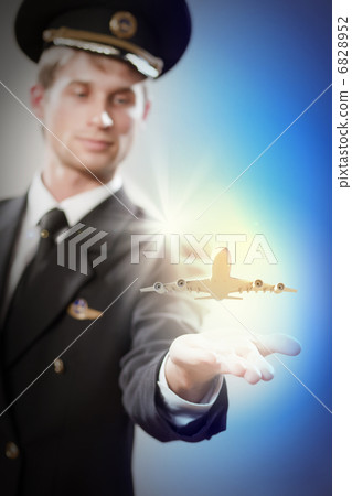 Image of pilot with plane in hand 6828952