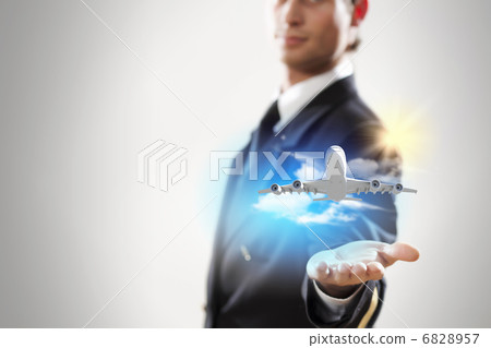 Image of pilot with plane in hand 6828957