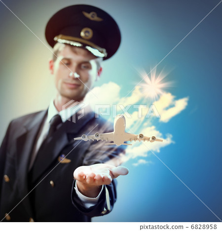 Image of pilot with plane in hand 6828958