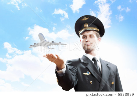 Image of pilot with plane in hand 6828959
