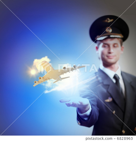 Image of pilot with plane in hand Image of pilot with plane in hand 6828963