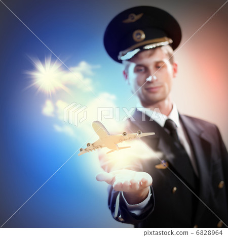 Image of pilot with plane in hand Image of pilot with plane in hand 6828964