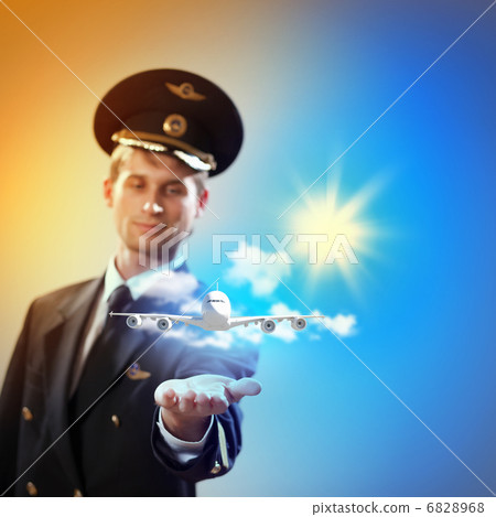 Image of pilot with plane in hand 6828968