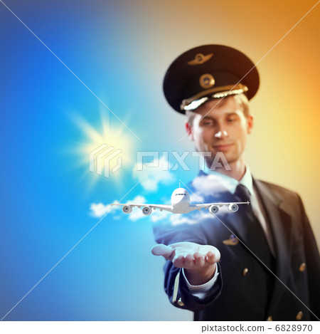 Image of pilot with plane in hand 6828970