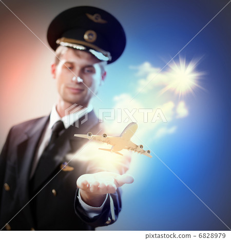 Image of pilot with plane in hand Image of pilot with plane in hand 6828979