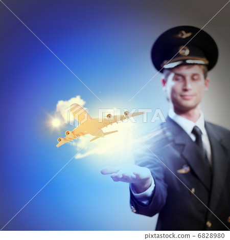 Image of pilot with plane in hand Image of pilot with plane in hand 6828980
