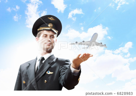 Image of pilot with plane in hand 6828983