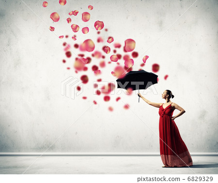 Ballet dancer in flying satin dress with umbrella 6829329