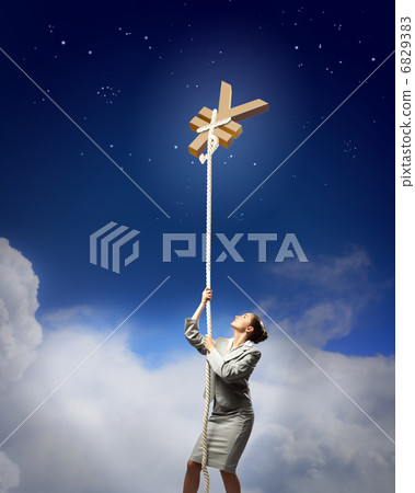 Image of businesswoman climbing the rope 6829383