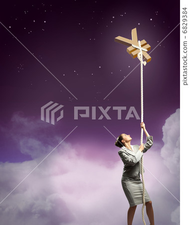 Image of businesswoman climbing the rope 6829384