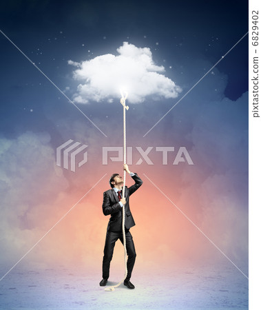Image of businessman climbing rope 6829402