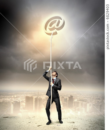 Image of businessman climbing rope 6829403