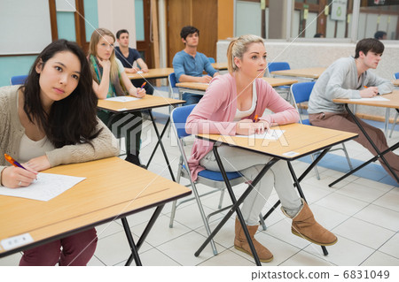 Students sitting at the classroom 6831049