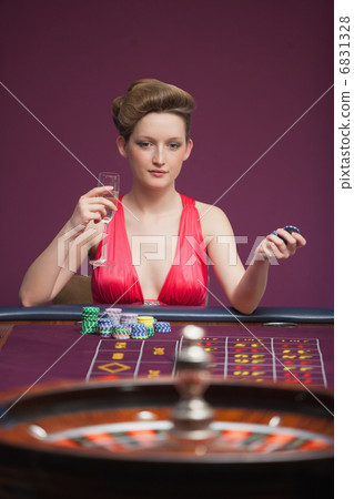 Woman playing roulette alone Woman playing roulette alone 6831328