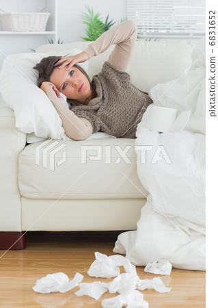 Upset and sick women lying on the sofa Upset and sick women lying on the sofa 6831652