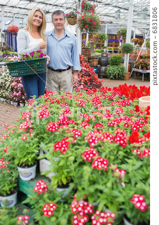 Woman carrying a basket with partner 6831806