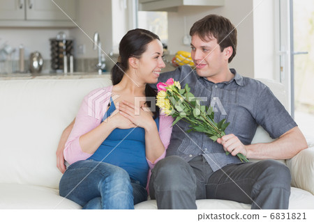 Man giving woman flowers Man giving woman flowers 6831821