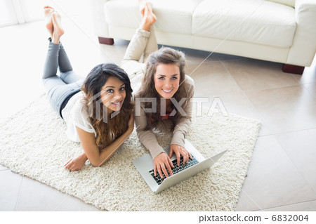 Two women using a computer Two women using a computer 6832004