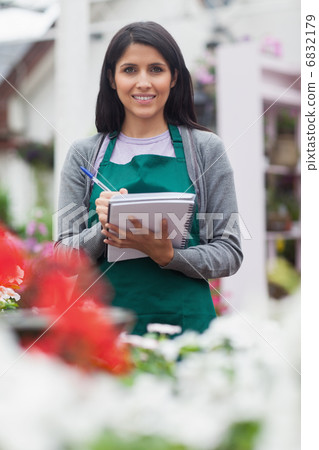 Woman checking plants Woman checking plants 6832179