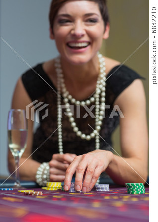 Woman laughing at table Woman laughing at table 6832210