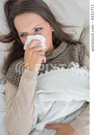 Sick woman on the couch 6832751