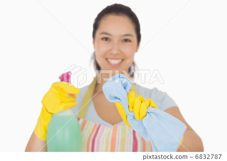 Happy woman wiping in front of her 6832787