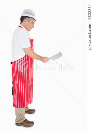 Butcher using meat cleaver 6832834