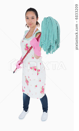 Woman holding a mop in the air Woman holding a mop in the air 6833209