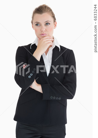 Woman wearing suit and being thoughtful Woman wearing suit and being thoughtful 6833244