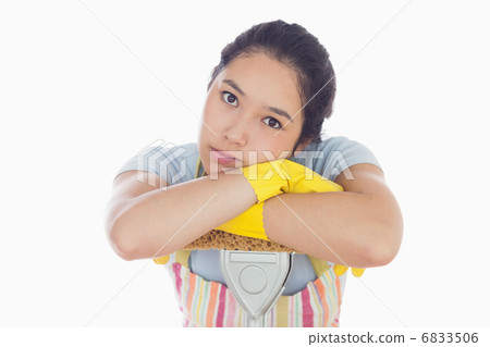 Sad woman leaning on mop 6833506