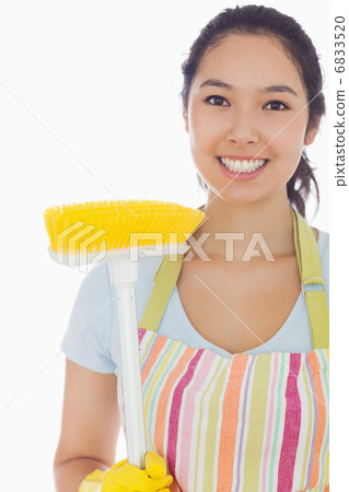 Smiling woman with broom 6833520