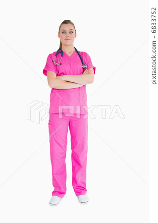 Doctor wearing pink scrubs 6833752