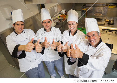 Team of Chefs giving thumbs up 6833966