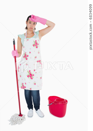 Discouraged woman cleaning floor Discouraged woman cleaning floor 6834099