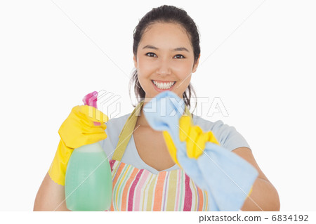 Smiling woman wiping in front of her 6834192