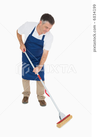 Man mopping the floor 6834199