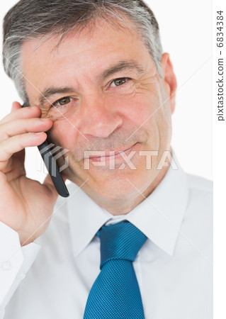 Happy man on mobile phone 6834384