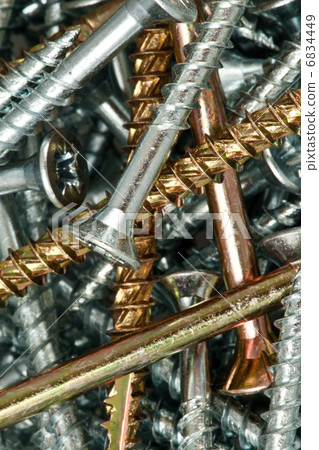 Golden and silver screws 6834449